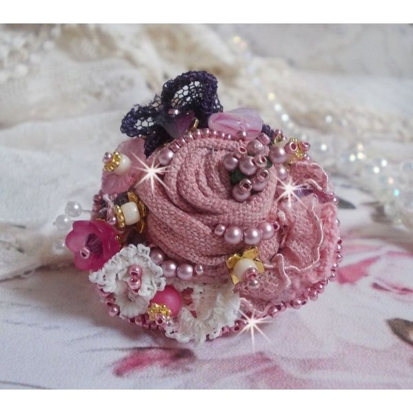 Poetic Garden ring embroidered with linen, fine lace, Swarovski crystals, Mother of Pearl leaf, Lucite flowers, glass beads and seed beads 