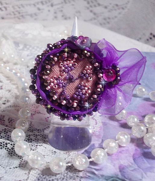 Romantic Lady Ring embroidered with on a pink linen fabric with Pink, Iris, Purple and Peach seed beads 