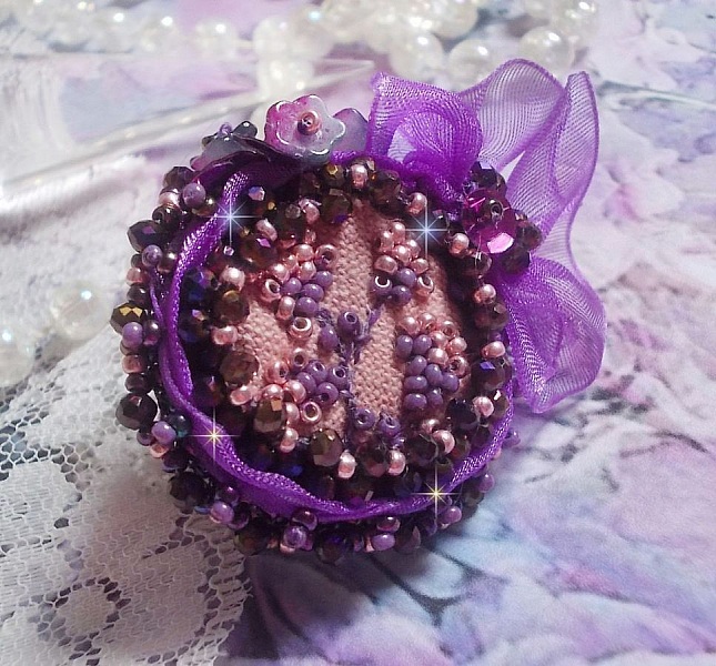 Romantic Lady Ring embroidered with on a pink linen fabric with Pink, Iris, Purple and Peach seed beads 