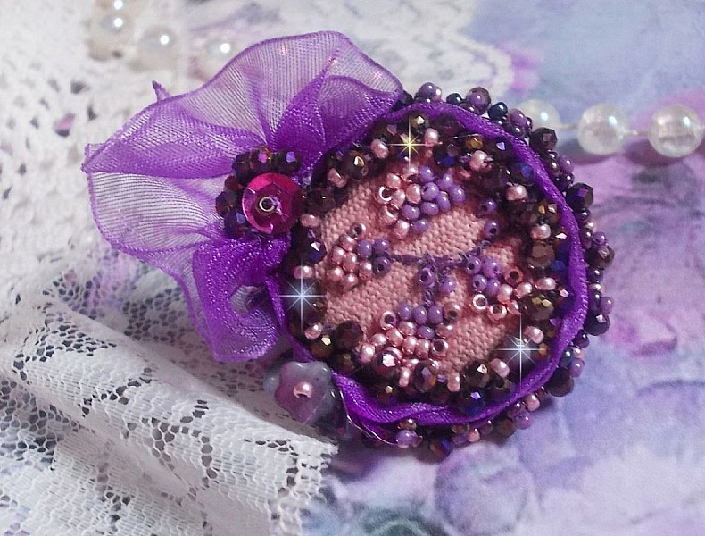 Romantic Lady Ring embroidered with on a pink linen fabric with Pink, Iris, Purple and Peach seed beads 