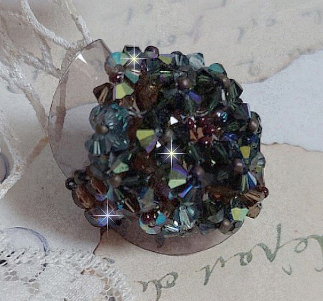 Long Brown Picasso ring created with faceted Swarovski crystals and spinners in Brown, Indian Sapphire and Turmaline AB quality with seed beads