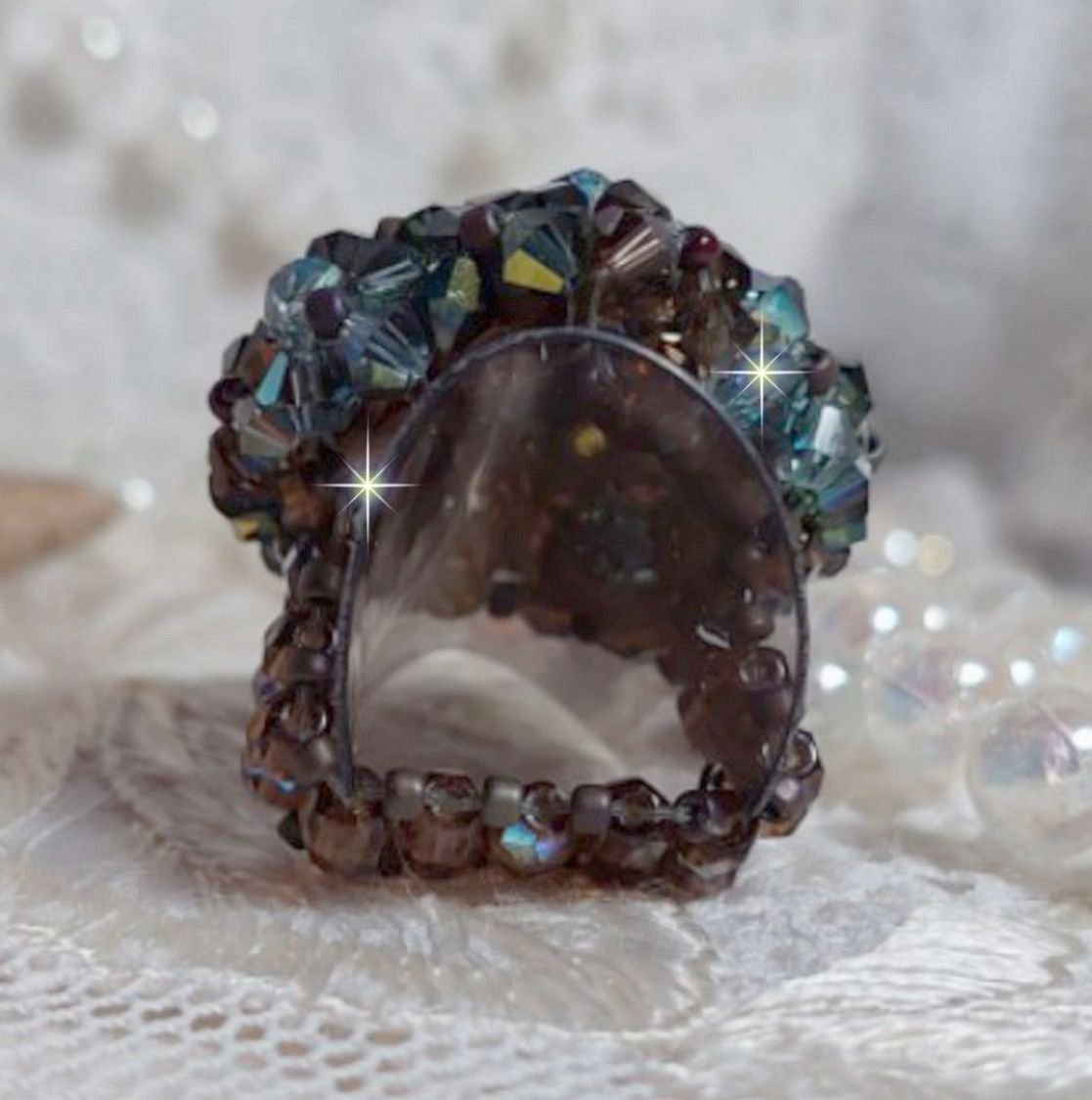 Long Brown Picasso ring created with faceted Swarovski crystals and spinners in Brown, Indian Sapphire and Turmaline AB quality with seed beads