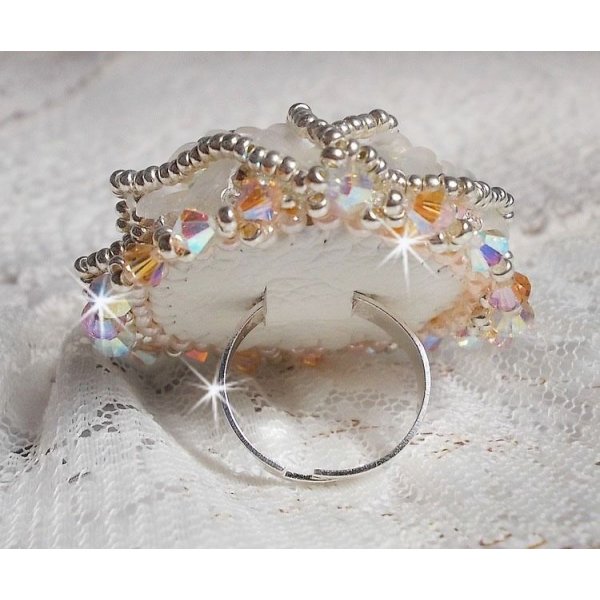 Bouquet d'un Jour ring embroidered with lucite lilies, Swarovski crystal spinning tops, a pearly cabochon with silver and salmon seed beads