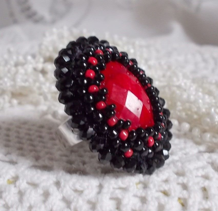 Midnight in Paris ring embroidered with a red faceted cabochon and black round beads