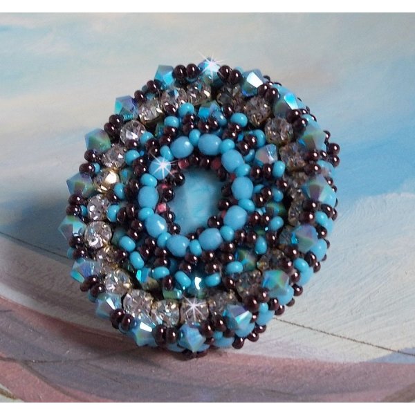 Naiad ring embroidered with a turquoise blue resin cabochon and crystal, a beautiful play of light.