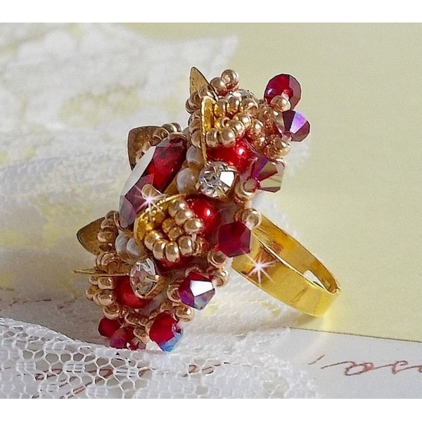 Ring L'Oiseau des Iles Rouge Dor&eacute; embroidered with pearly pearls, Swarovski crystals, a beautiful flower print and seed beads.