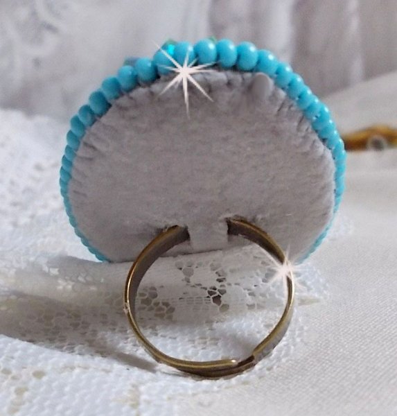 Turquoise ring embroidered with a Turquoise cabochon, PureCrystal spinners and seed beads