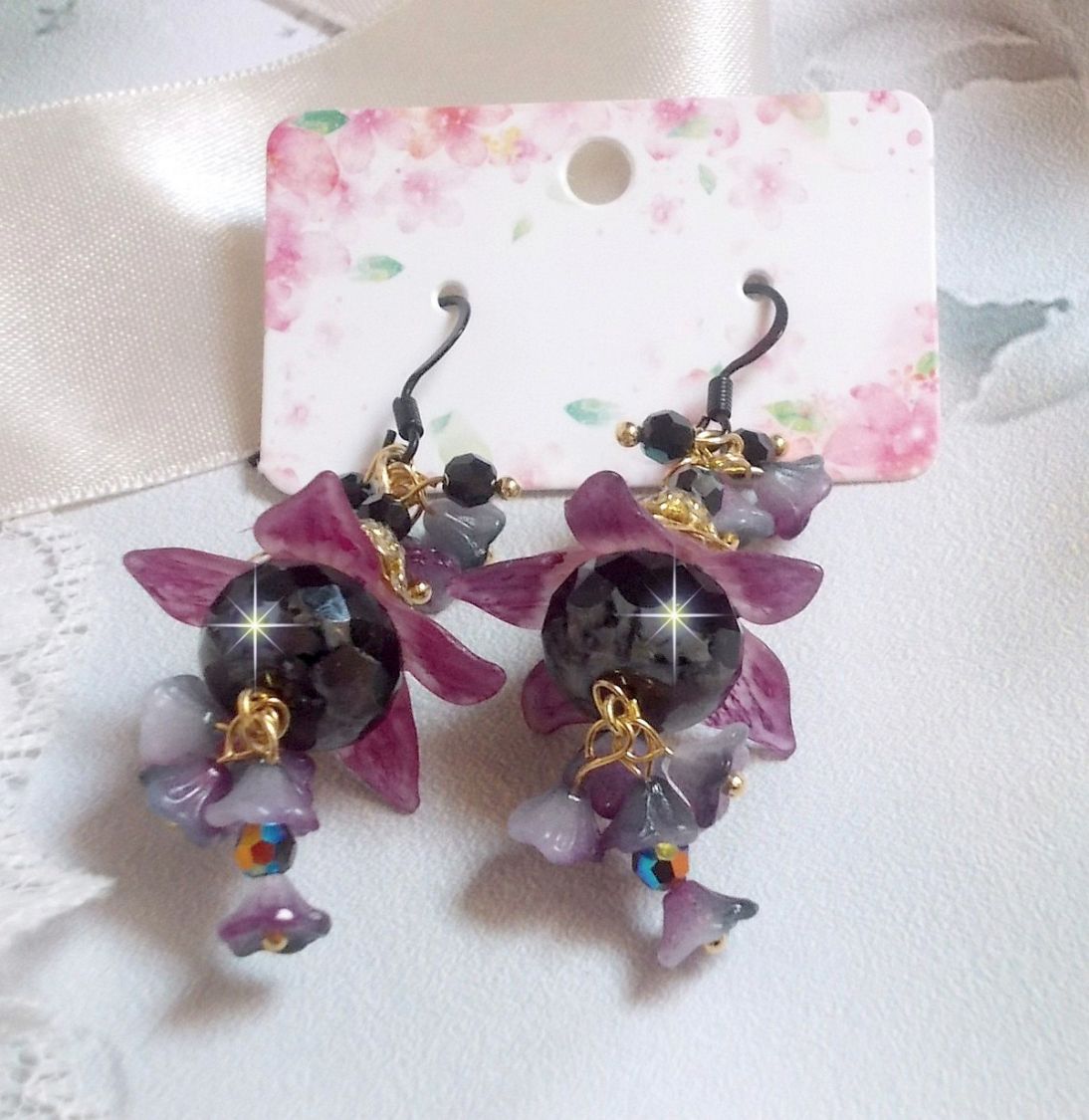 BO Funky Black created with hand painted Lucite flowers in Purple, crystals, glass beads and various Gold and Black accessories