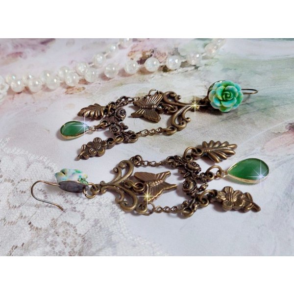 BO Green Palace created with crystals, charms, stamps, pink resin cabochons and faceted glass pendants