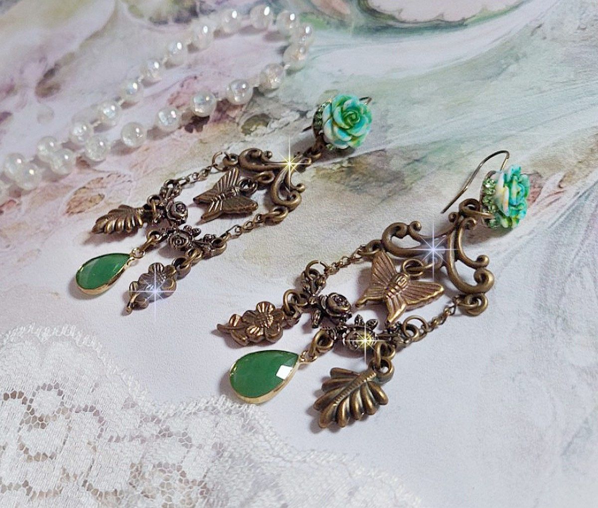 BO Green Palace created with crystals, charms, stamps, pink resin cabochons and faceted glass pendants