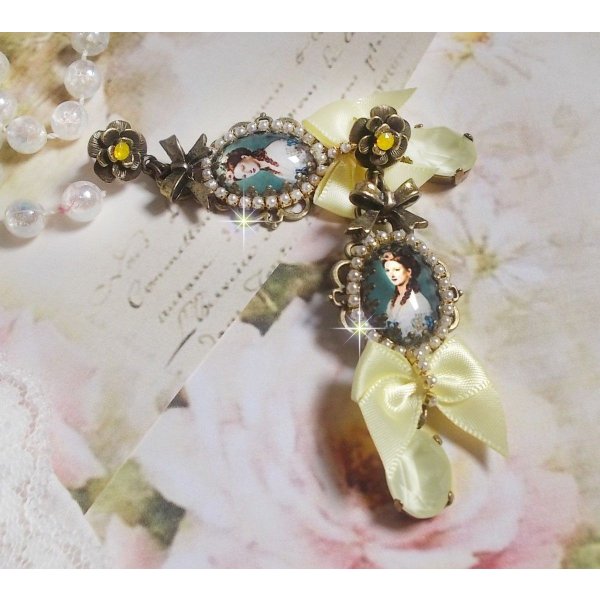 BO Princess look created with cabochons representing a lady princess, crystals, glass beads, bronze accessories and yellow satin bows