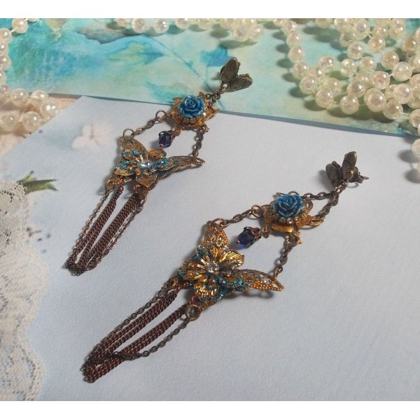 Iridescent butterflies created with Zirconium, Swarovski crystals, Resin cabochons, various accessories and Bohemian glass beads