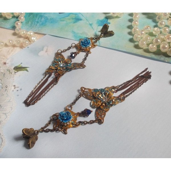 Iridescent butterflies created with Zirconium, Swarovski crystals, Resin cabochons, various accessories and Bohemian glass beads