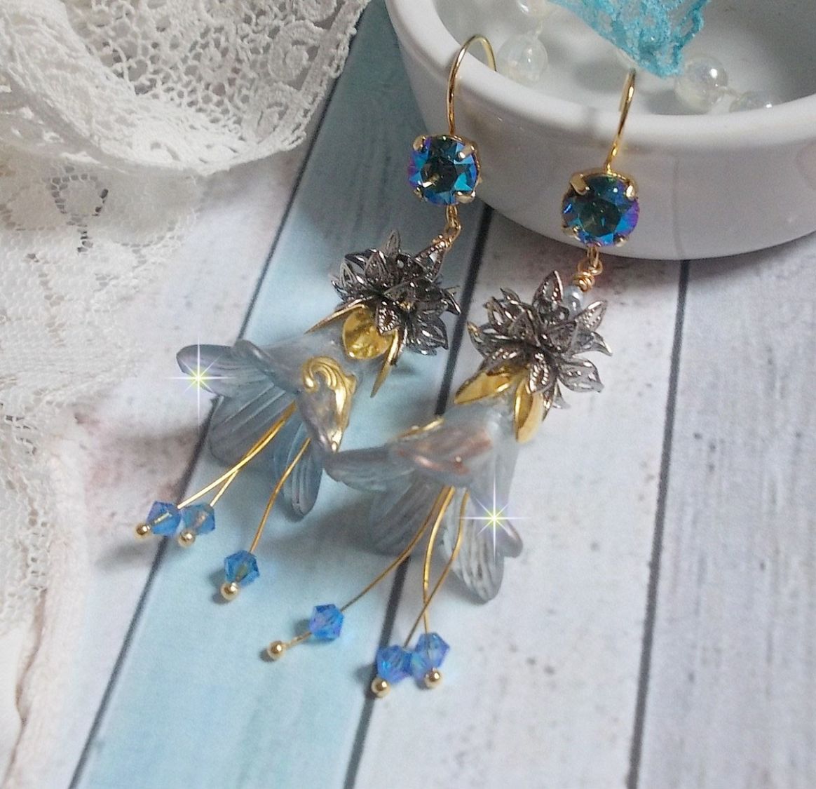 BO Sensations Gold and Blue created with hand painted trumpet flowers, crystals, glass flowers and gold plated accessories