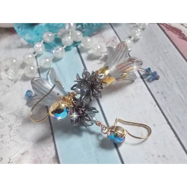 BO Sensations Gold and Blue created with hand painted trumpet flowers, crystals, glass flowers and gold plated accessories