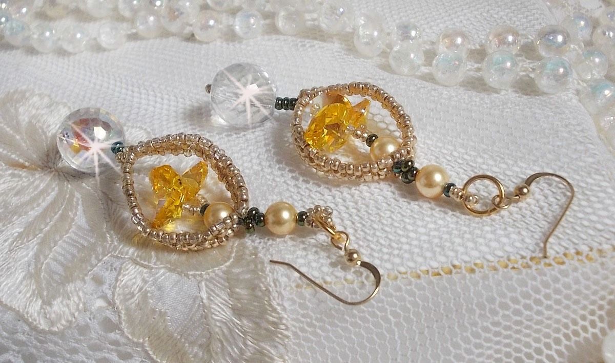 BO Bo'Soleil mounted with Swarovski crystal hearts, Gold pearl beads and 14K Gold Filled ear hooks