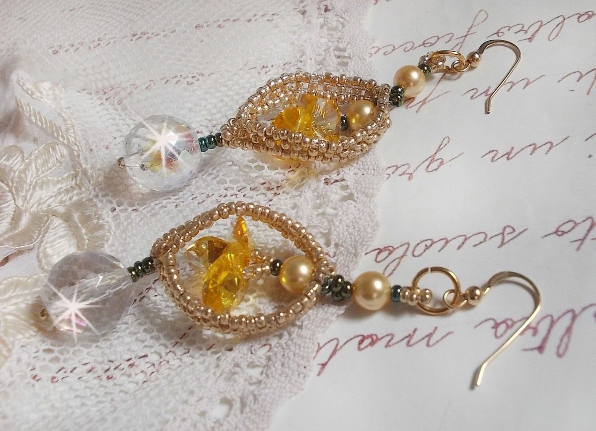 BO Bo'Soleil mounted with Swarovski crystal hearts, Gold pearl beads and 14K Gold Filled ear hooks