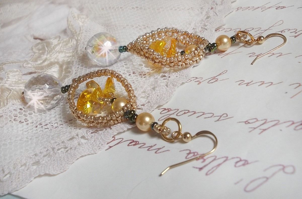 BO Bo'Soleil mounted with Swarovski crystal hearts, Gold pearl beads and 14K Gold Filled ear hooks