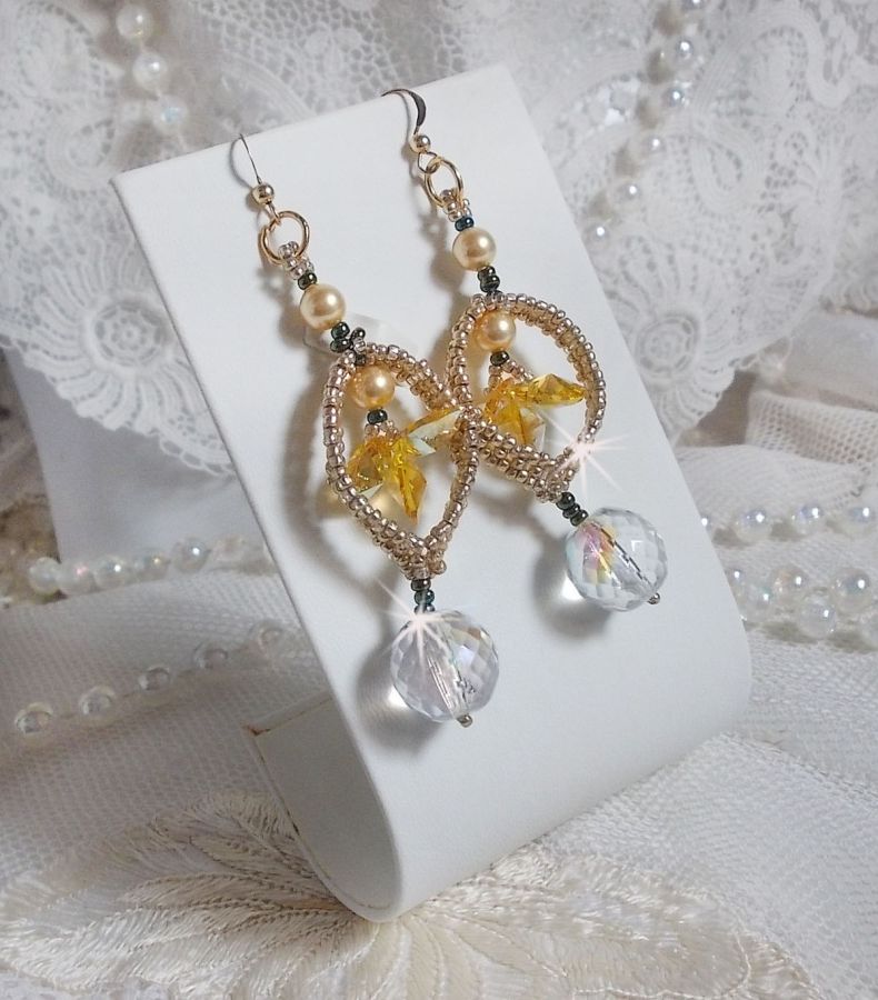 BO Bo'Soleil mounted with Swarovski crystal hearts, Gold pearl beads and 14K Gold Filled ear hooks