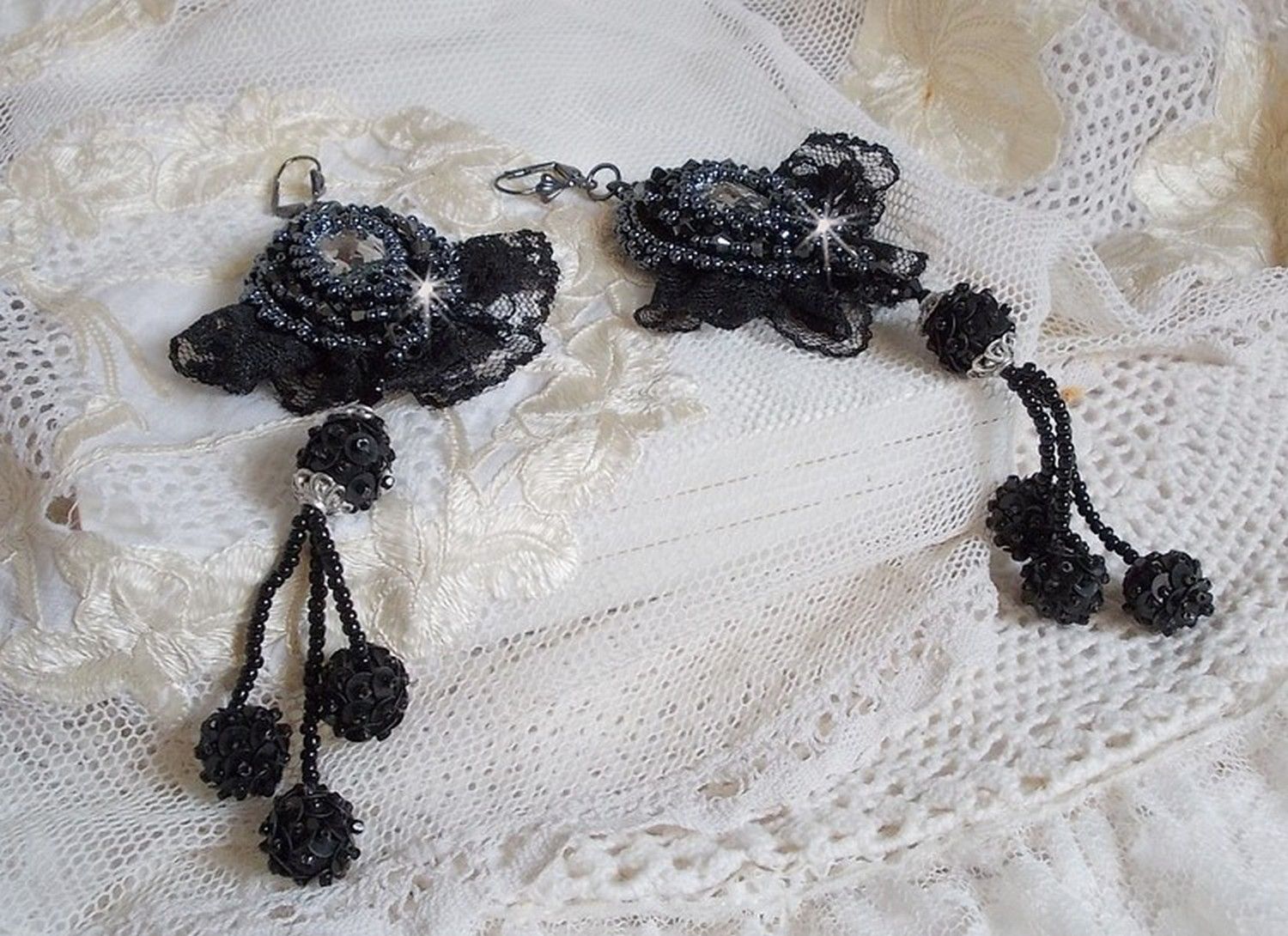 BO Evening wear embroidered with Swarovski crystals, a very old black lace, round beads woven with sequins and seed beads