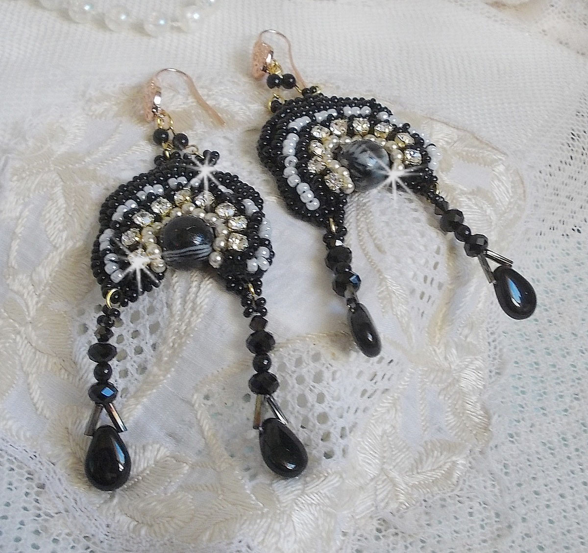 BO Féerie Black are embroidered with Swarovski crystals, crystal chatons, round faceted flattened beads, twisted Bugles and seed beads