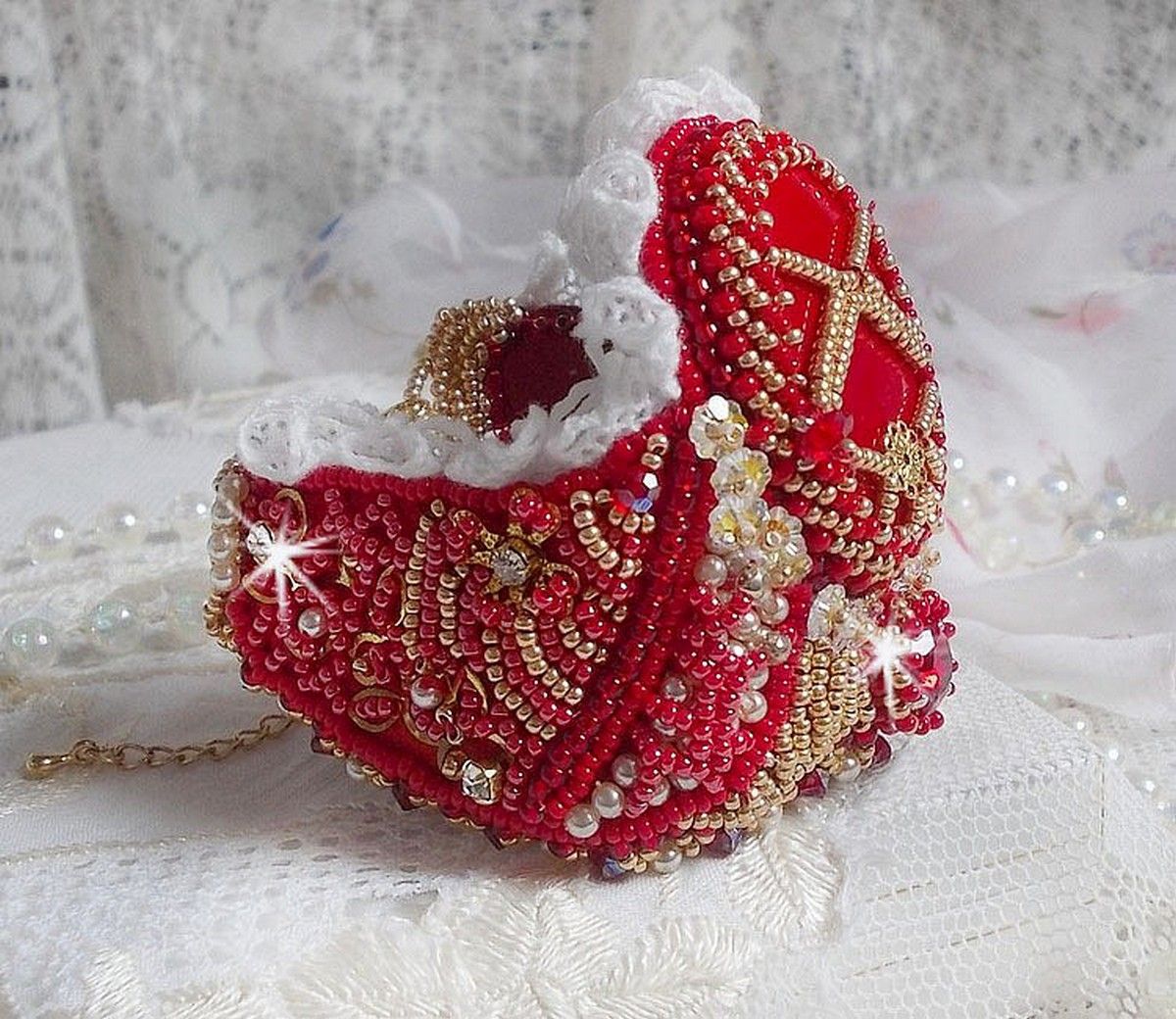 Bracelet Nous Two Haute-Couture cuff embroidered with Swarovski crystals, an oval red glass cabochon and seed beads