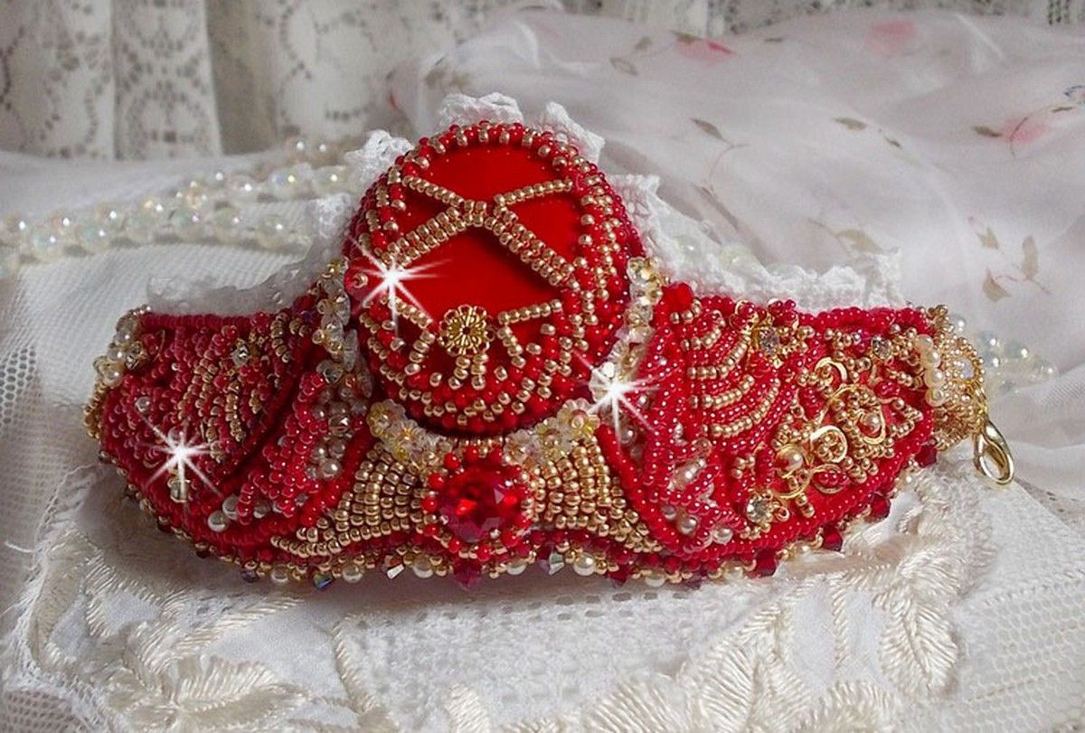 Bracelet Nous Two Haute-Couture cuff embroidered with Swarovski crystals, an oval red glass cabochon and seed beads