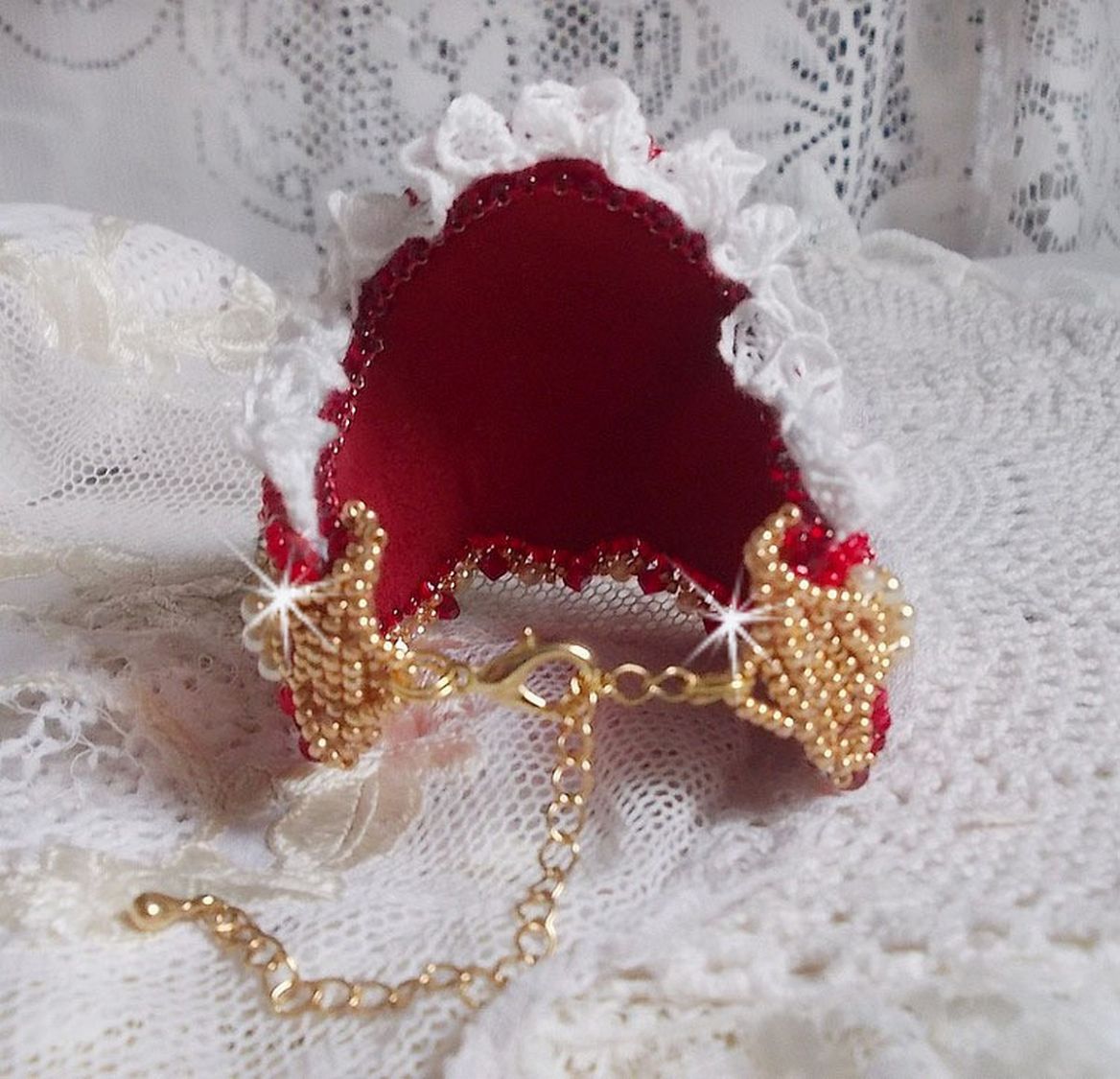 Bracelet Nous Two Haute-Couture cuff embroidered with Swarovski crystals, an oval red glass cabochon and seed beads