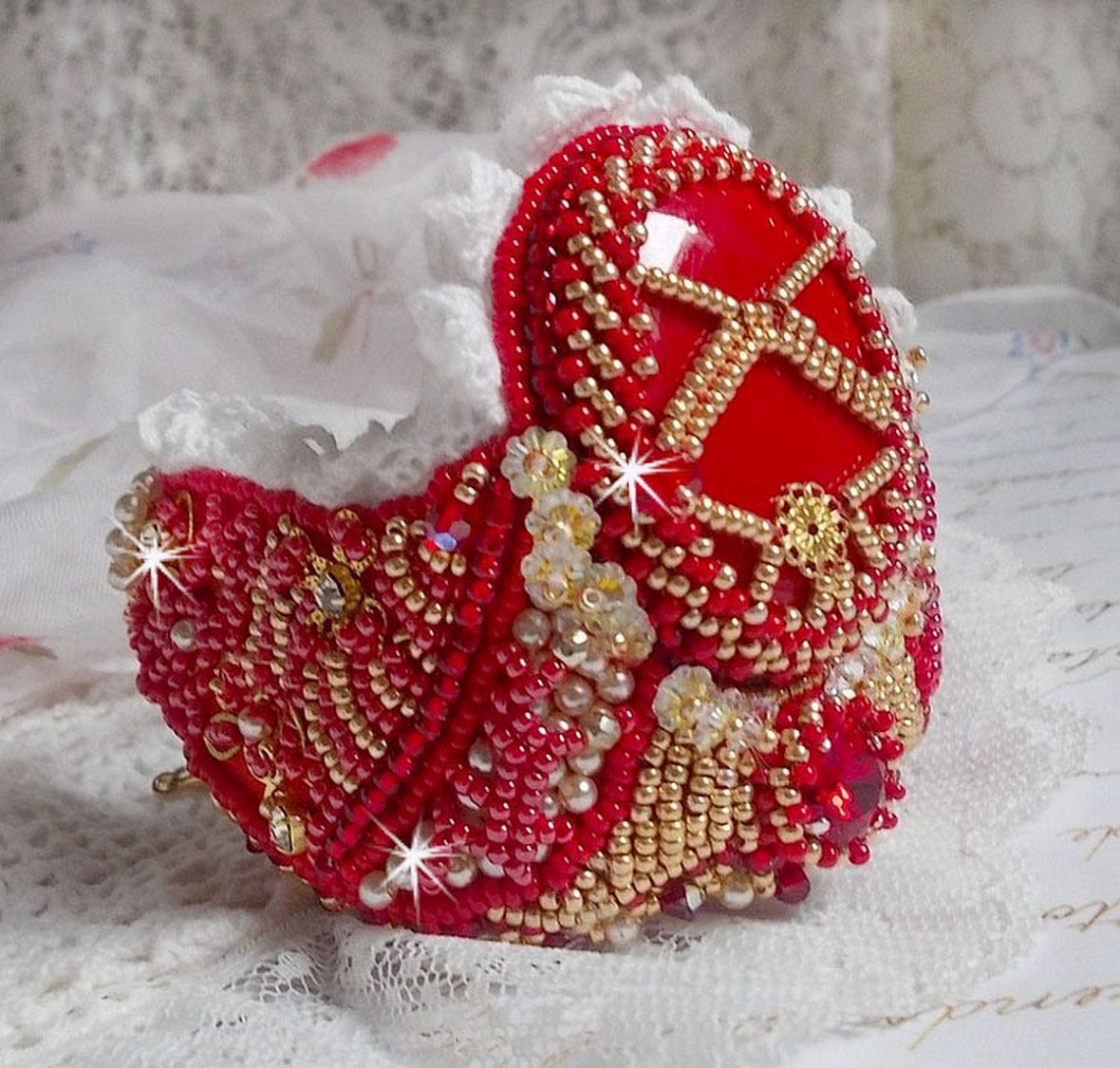 Bracelet Nous Two Haute-Couture cuff embroidered with Swarovski crystals, an oval red glass cabochon and seed beads