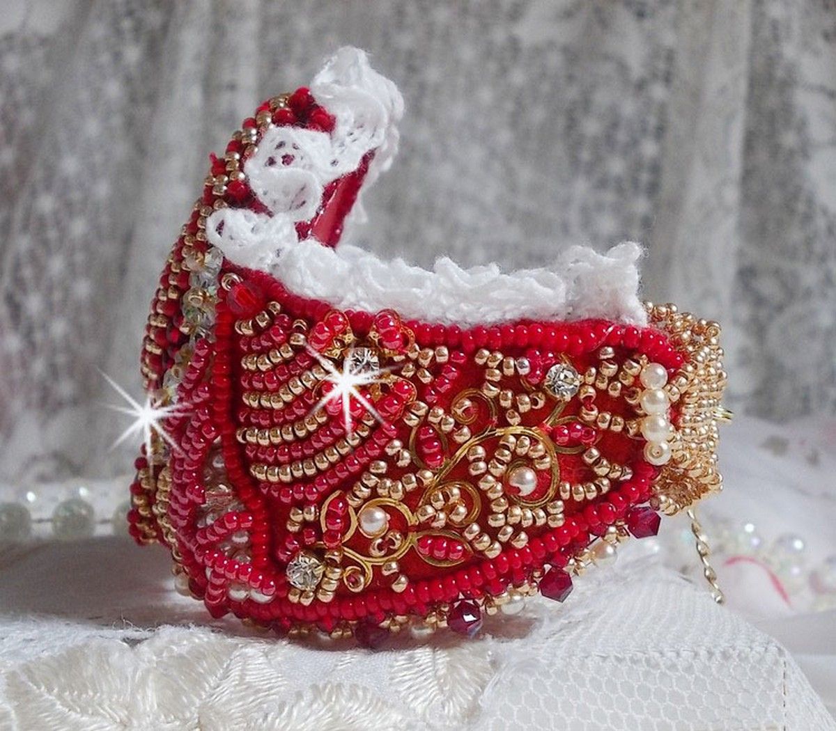 Bracelet Nous Two Haute-Couture cuff embroidered with Swarovski crystals, an oval red glass cabochon and seed beads