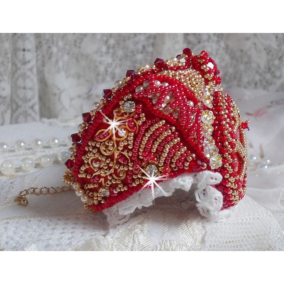 Bracelet Nous Two Haute-Couture cuff embroidered with Swarovski crystals, an oval red glass cabochon and seed beads