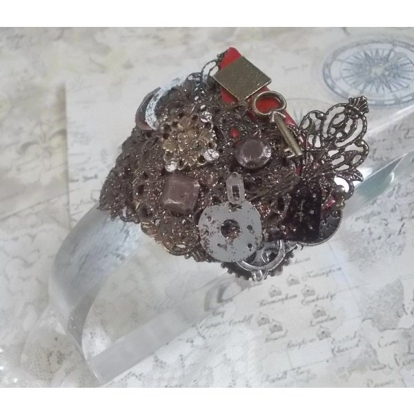 Navigating Shadow bracelet created with Cognac leather, fabric flower, accessories in Bronze, Copper, Black with charms