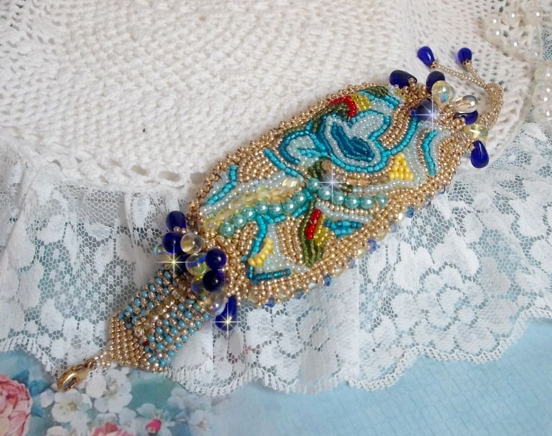 Blue Gold Butterfly bracelet embroidered with Swarovski crystals; smooth drops, facets, seed beads and a 14K Gold Filled clasp