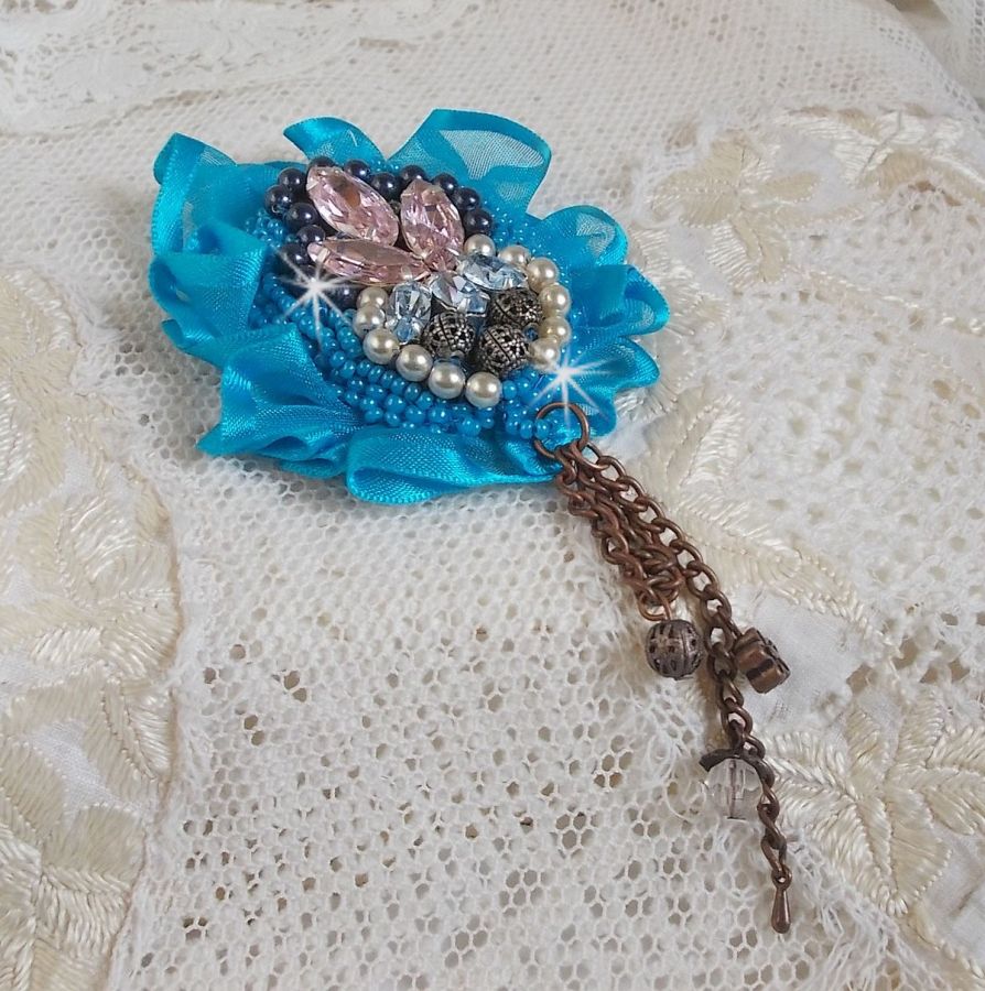 Belle Epoque Haute-Couture brooch is embroidered with Swarovski crystals, round pearls, charms, ribbon and seed beads