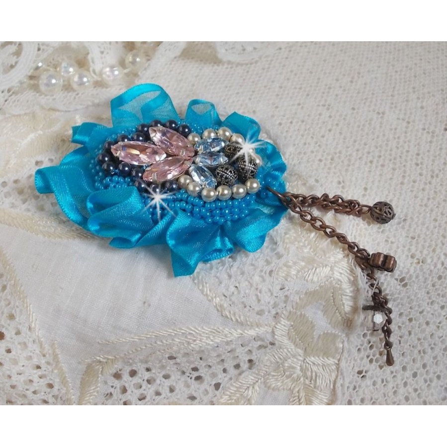 Belle Epoque Haute-Couture brooch is embroidered with Swarovski crystals, round pearls, charms, ribbon and seed beads