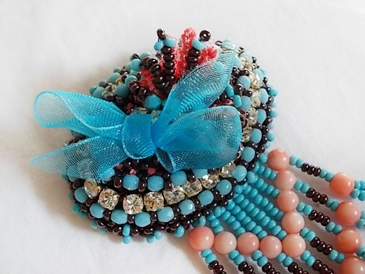 Naiad brooch embroidered with gemstone beads (Turquoise and Coral), crystals, cowhide and seed beads