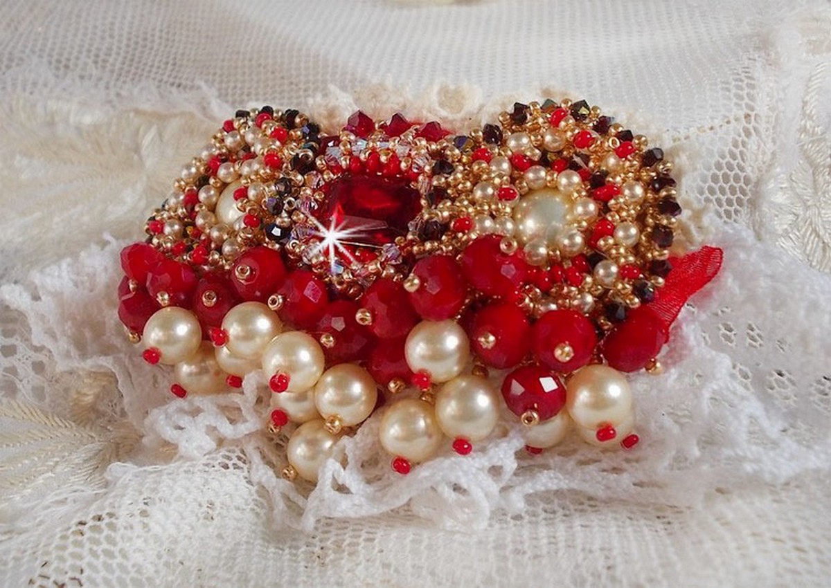 Ruby brooch embroidered with a 1960's bohemian glass cabochon, pearls, Swarovski crystals and seed beads