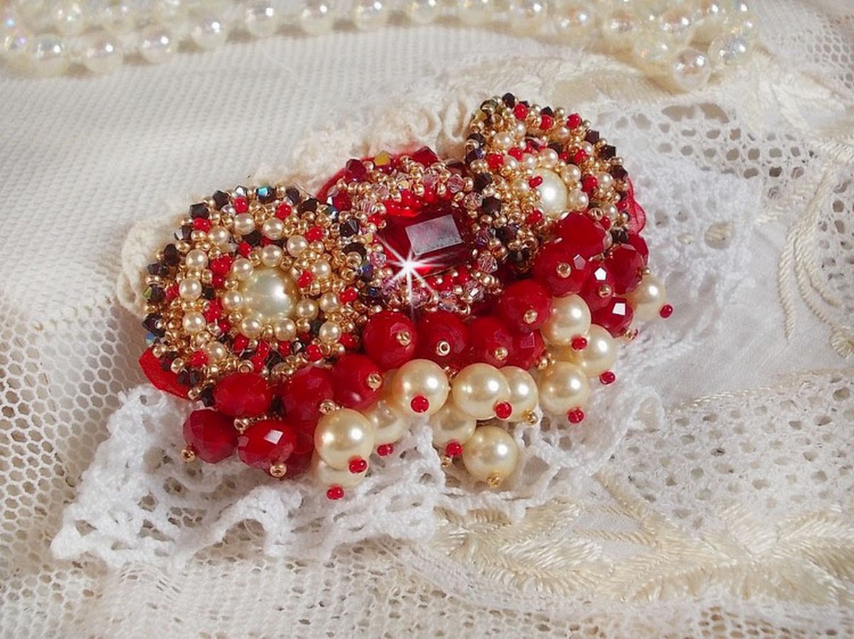 Ruby brooch embroidered with a 1960's bohemian glass cabochon, pearls, Swarovski crystals and seed beads