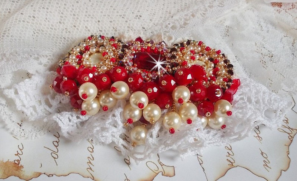 Ruby brooch embroidered with a 1960's bohemian glass cabochon, pearls, Swarovski crystals and seed beads