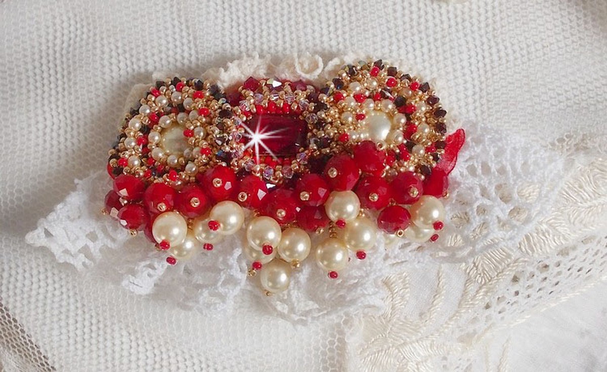 Ruby brooch embroidered with a 1960's bohemian glass cabochon, pearls, Swarovski crystals and seed beads