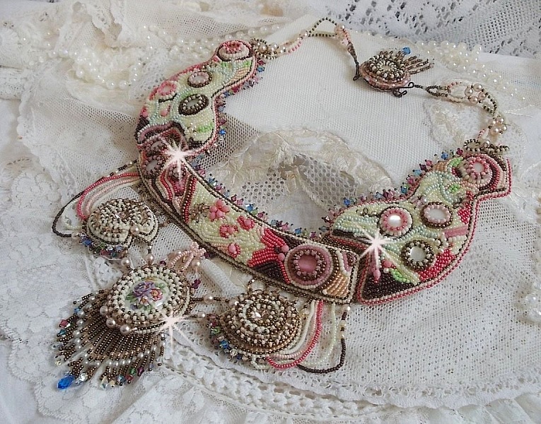 Arc-En-Ciel Haute-Couture necklace embroidered with a Limoge porcelain cabochon, Swarovski crystals and pearls. 