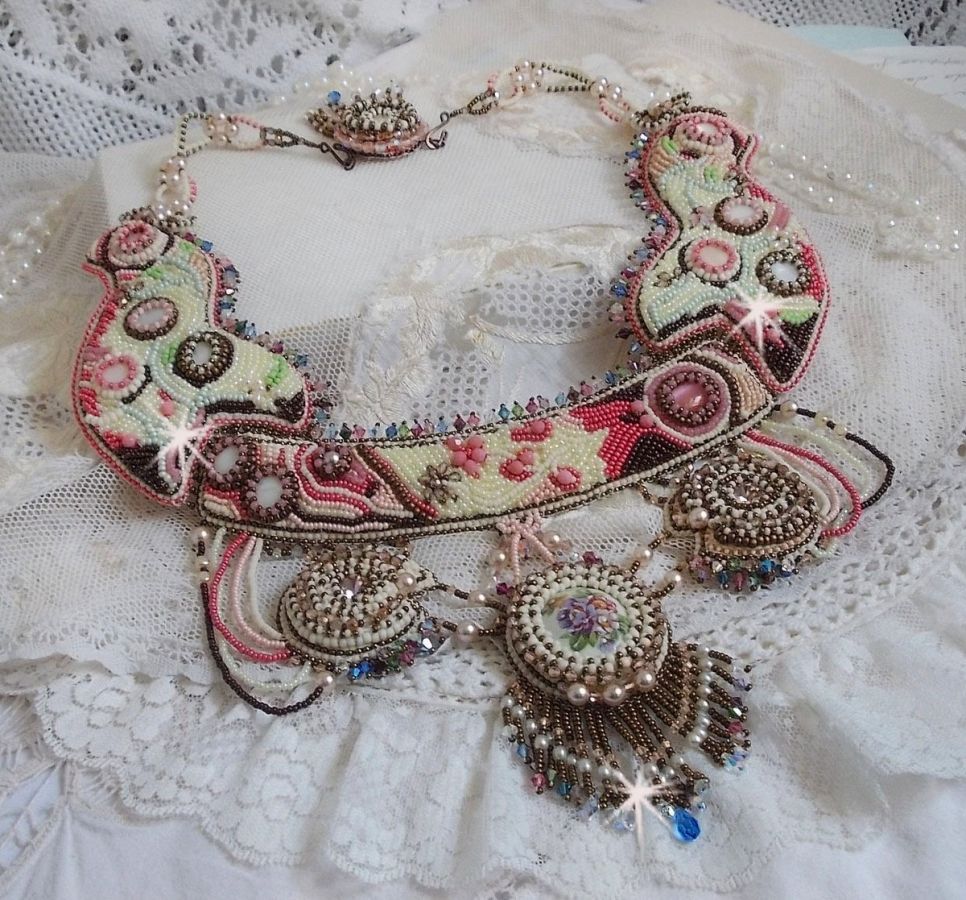 Arc-En-Ciel Haute-Couture necklace embroidered with a Limoge porcelain cabochon, Swarovski crystals and pearls. 