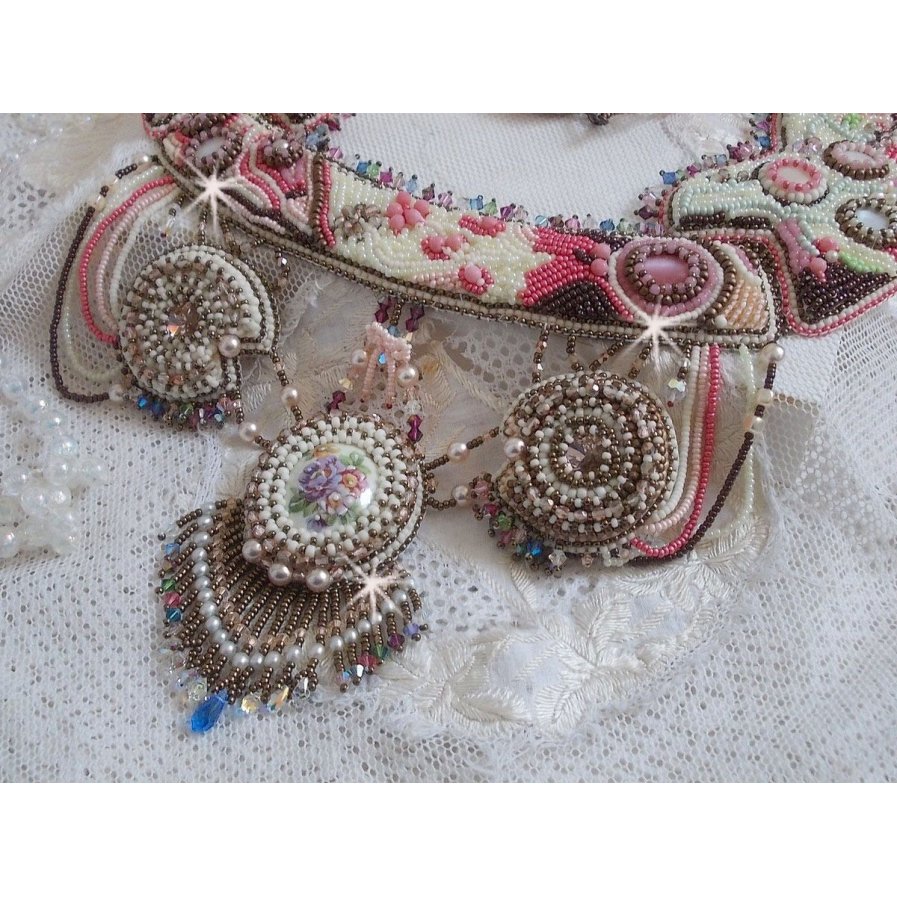 Arc-En-Ciel Haute-Couture necklace embroidered with a Limoge porcelain cabochon, Swarovski crystals and pearls. 