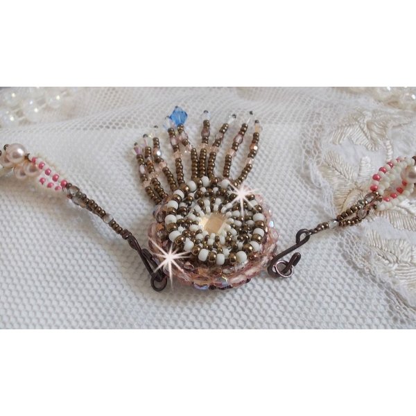 Arc-En-Ciel Haute-Couture necklace embroidered with a Limoge porcelain cabochon, Swarovski crystals and pearls. 