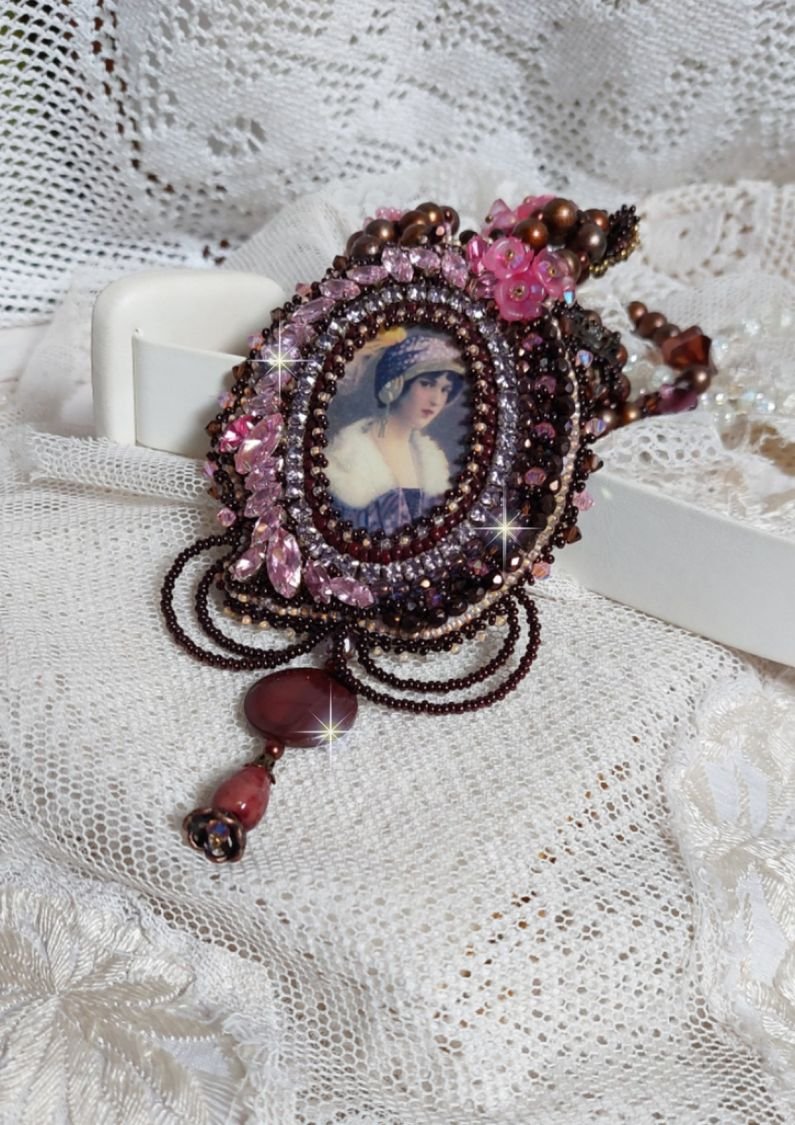 Belle Romance Haute-Couture necklace embroidered with a cabochon portrait of a woman in a hat with crystals, satin pearls, golden round pearls, mother of pearl cabochons and 