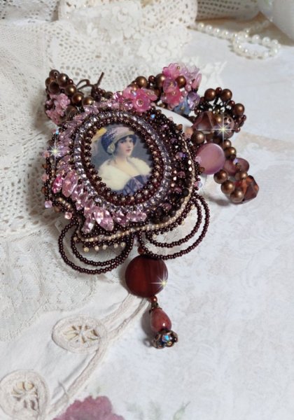 Belle Romance Haute-Couture necklace embroidered with a cabochon portrait of a woman in a hat with crystals, satin pearls, golden round pearls, mother of pearl cabochons and 