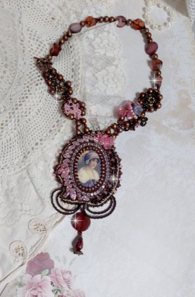 Belle Romance Haute-Couture necklace embroidered with a cabochon portrait of a woman in a hat with crystals, satin pearls, golden round pearls, mother of pearl cabochons and 
