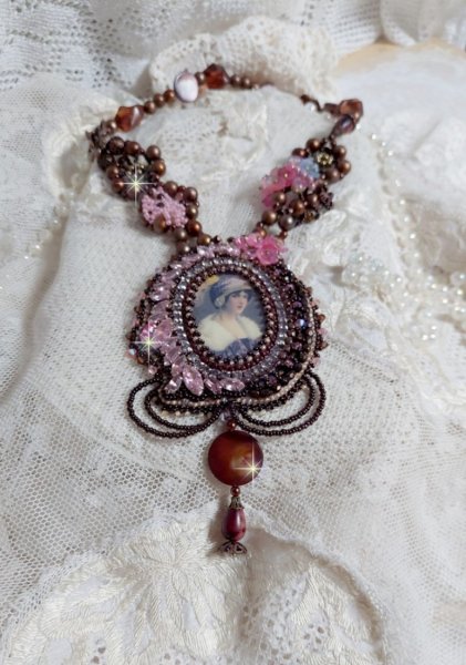 Belle Romance Haute-Couture necklace embroidered with a cabochon portrait of a woman in a hat with crystals, satin pearls, golden round pearls, mother of pearl cabochons and 