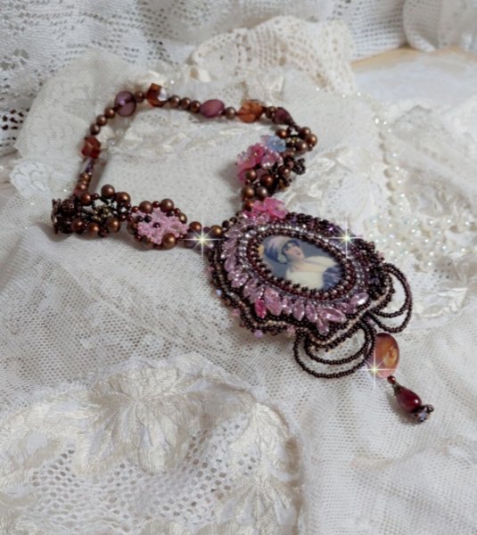 Belle Romance Haute-Couture necklace embroidered with a cabochon portrait of a woman in a hat with crystals, satin pearls, golden round pearls, mother of pearl cabochons and 