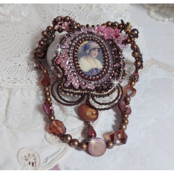 Belle Romance Haute-Couture necklace embroidered with a cabochon portrait of a woman in a hat with crystals, satin pearls, golden round pearls, mother of pearl cabochons and 
